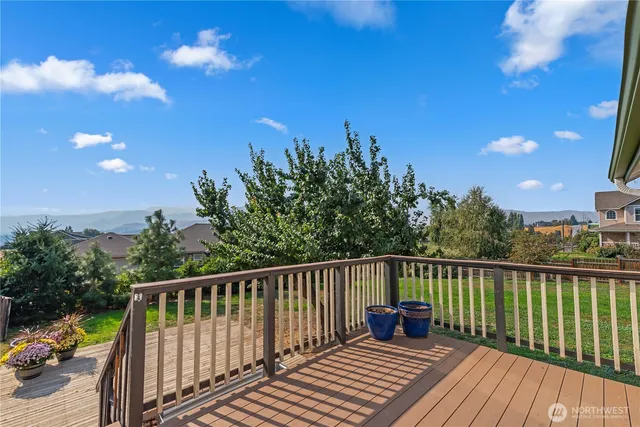 a view of a two chairs on the roof deck