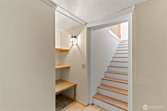 a view of entryway and hall with wooden floor