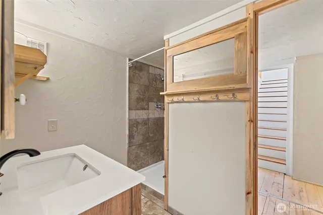 a bathroom with a bathtub and a shower