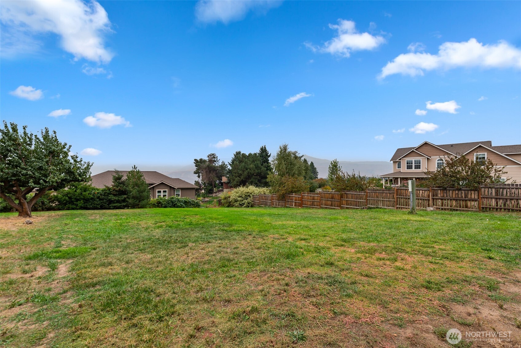 3724 School Street Wenatchee, WA 98801 - Photo 38 of 40 a view of a grassy field with trees in the background