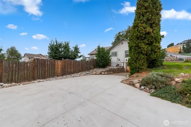 a backyard of a house with lots of green space