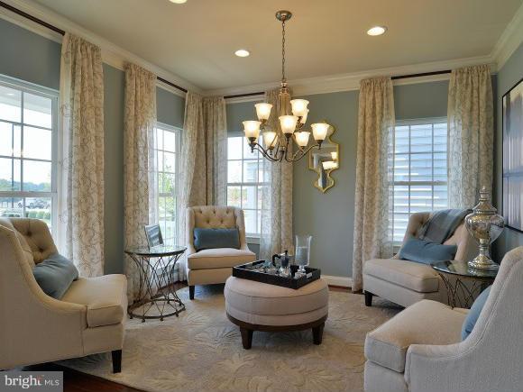 2505 Baileys Pond Road Accokeek, MD 20607 - Photo 2 of 16 a living room with furniture and a chandelier