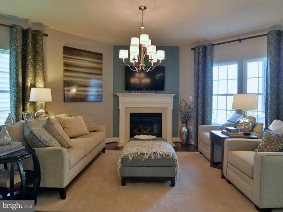 2505 Baileys Pond Road Accokeek, MD 20607 - Photo 5 of 16 a living room with furniture and a fireplace