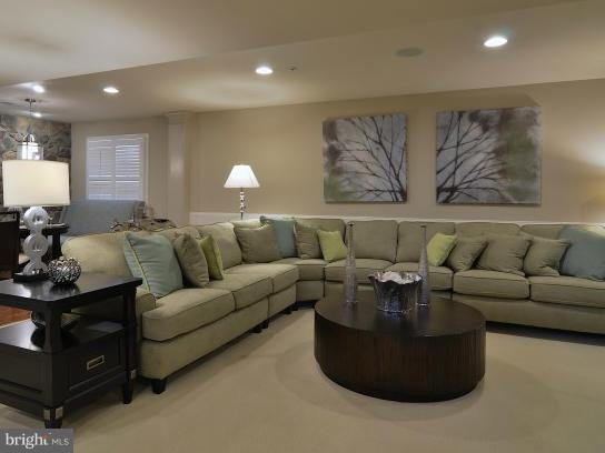 2505 Baileys Pond Road Accokeek, MD 20607 - Photo 8 of 16 a living room with furniture and a couch