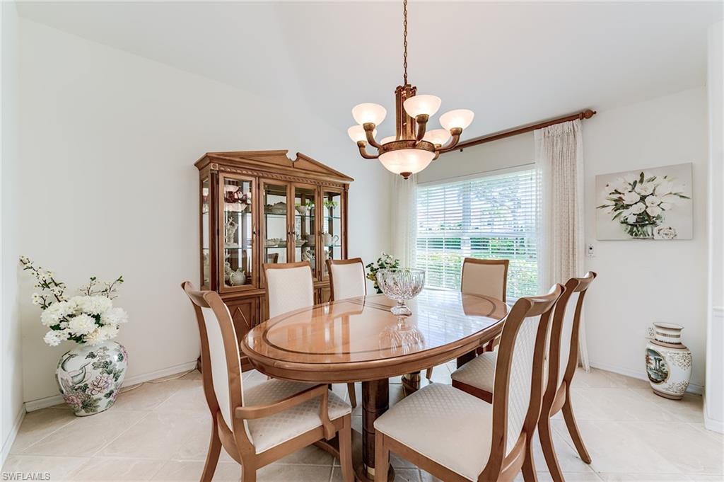 9156 Spring Run Boulevard Estero, FL 34135 - Photo 11 of 34 a view of a dining room with furniture window and outside view
