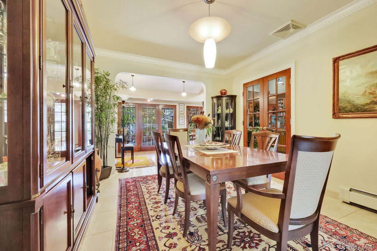 101 Harold Road Woodmere, NY 11598 - Photo 11 of 33 a view of a dining room with furniture window and wooden floor