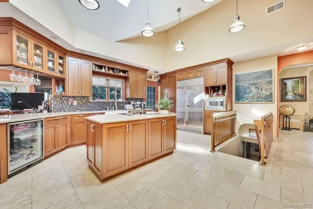 a kitchen with stainless steel appliances granite countertop a stove and cabinets