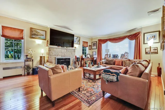 a living room with furniture fireplace and a flat screen tv