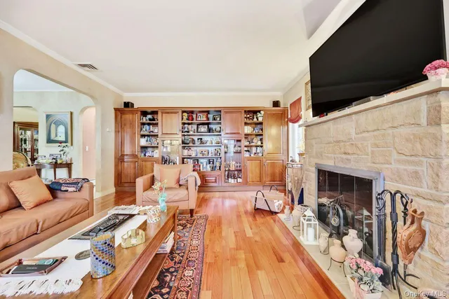 a living room with furniture fireplace and flat screen tv
