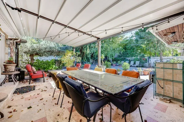 a outdoor dining space with furniture and outdoor view