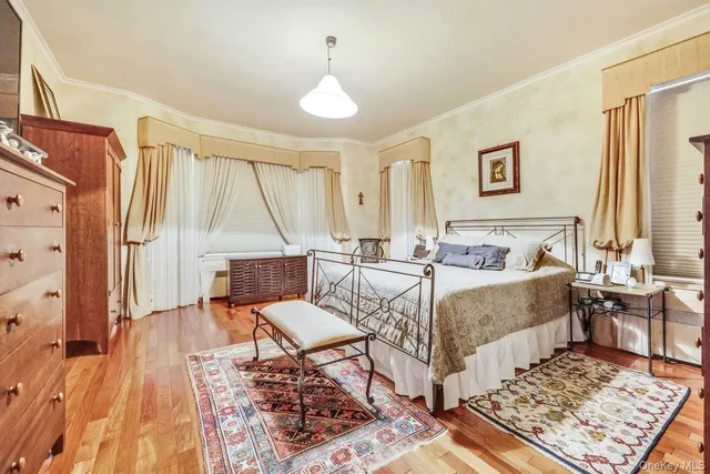 a living room with a bed and a table