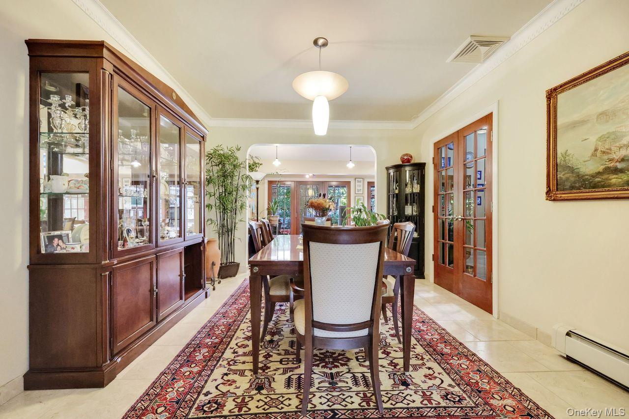 101 Harold Road Woodmere, NY 11598 - Photo 10 of 33 a view of a dining room with furniture window and wooden floor