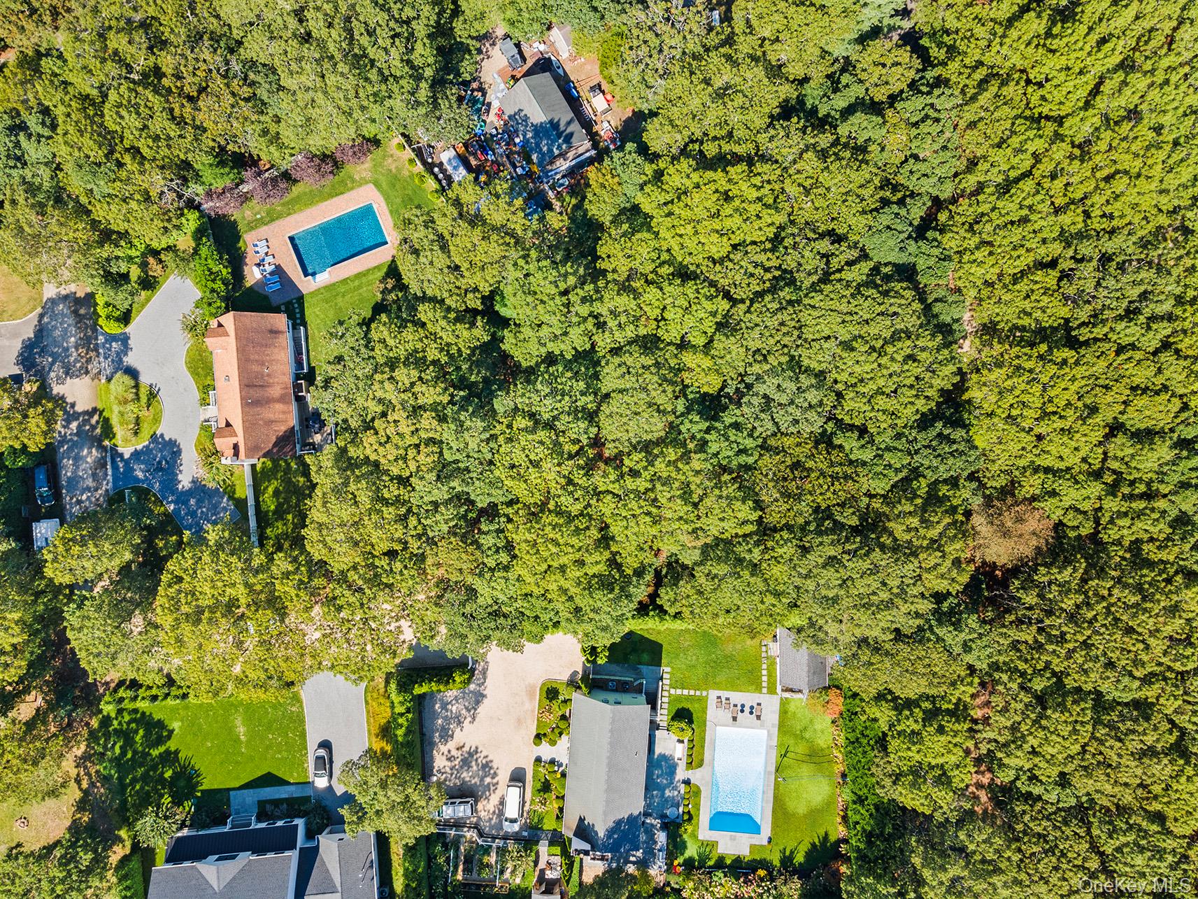 4 Calvin Street East Hampton, NY 11937 - Photo 12 of 23 an aerial view of a house with a yard and garden