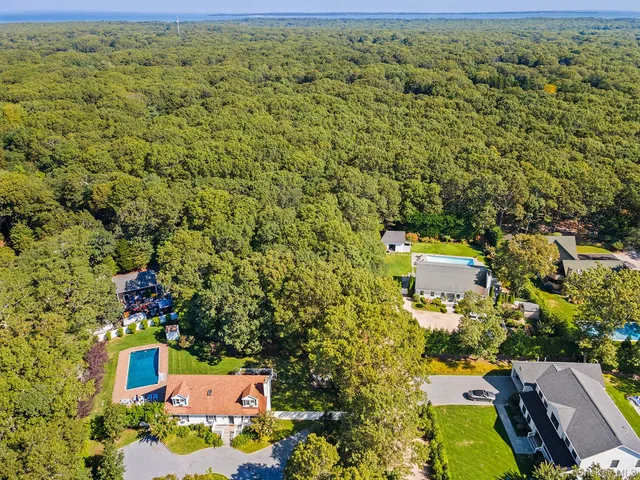 an aerial view of residential houses with outdoor space