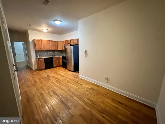 a view of a kitchen with a sink