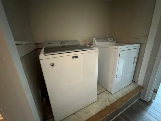 a utility room with dryer and washer