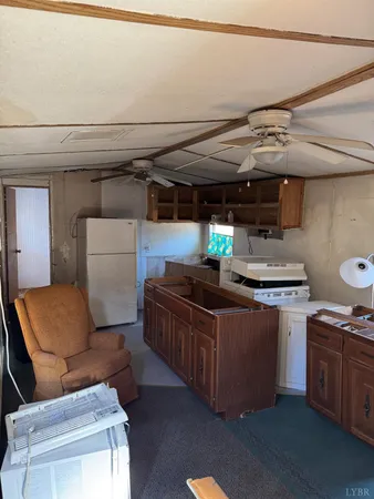 a kitchen with stainless steel appliances granite countertop a stove and a refrigerator