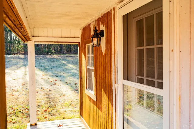 a view of an empty room with windows