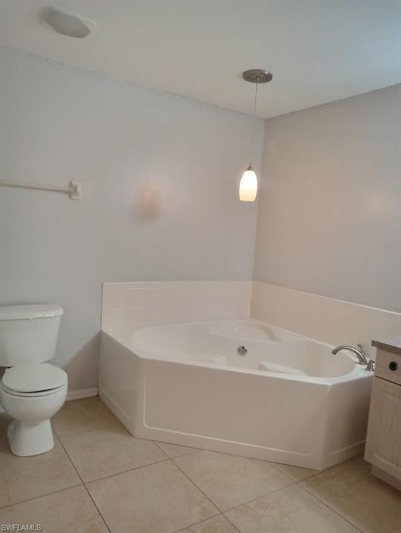 9148 Henry Road Fort Myers, FL 33967 - Photo 11 of 34 a white bath tub sitting next to a white toilet