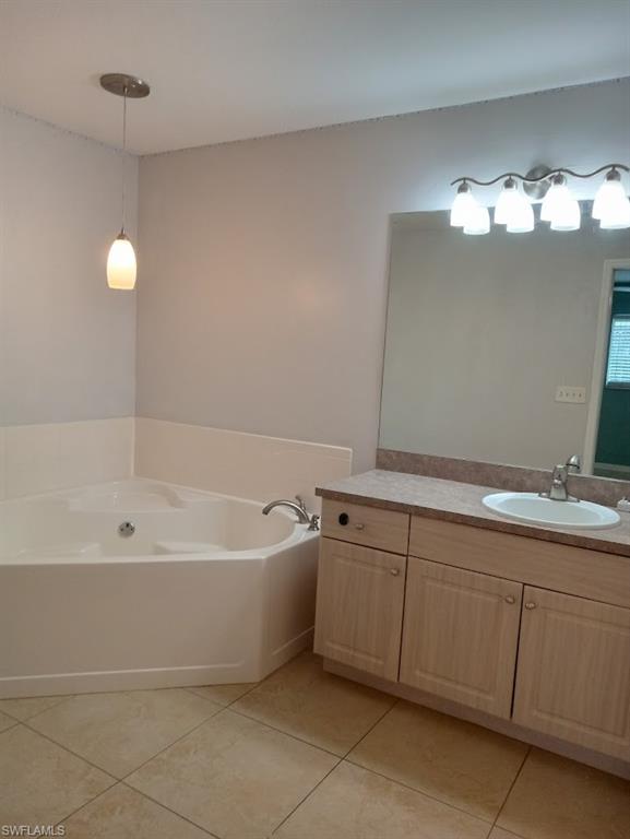 9148 Henry Road Fort Myers, FL 33967 - Photo 12 of 34 a bathroom with a sink mirror and bathtub