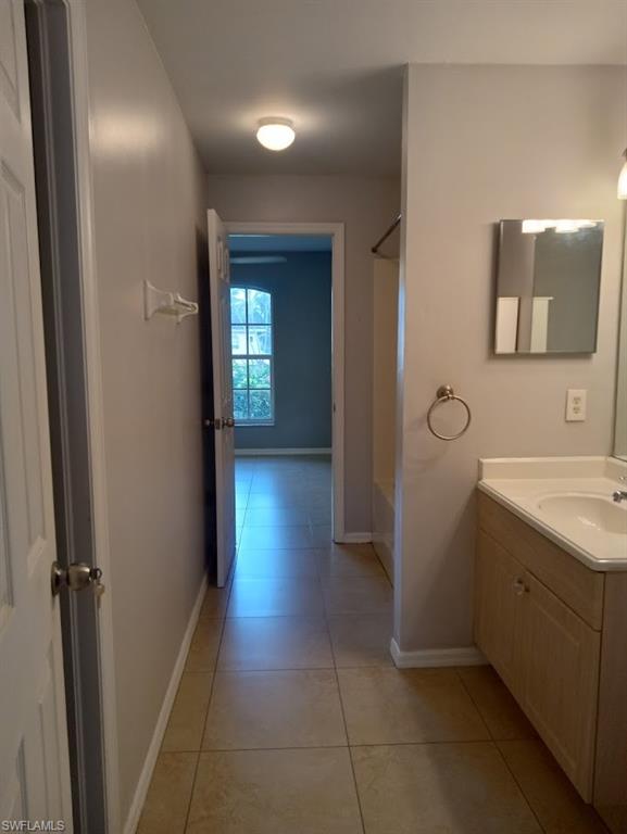 9148 Henry Road Fort Myers, FL 33967 - Photo 17 of 34 a bathroom with a sink a toilet and mirror