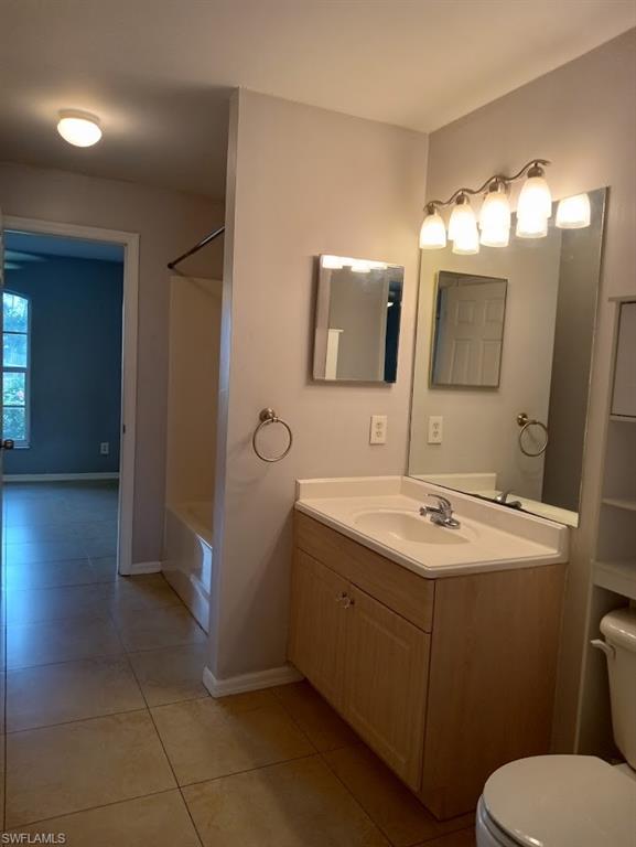 9148 Henry Road Fort Myers, FL 33967 - Photo 18 of 34 a bathroom with a sink toilet and mirror