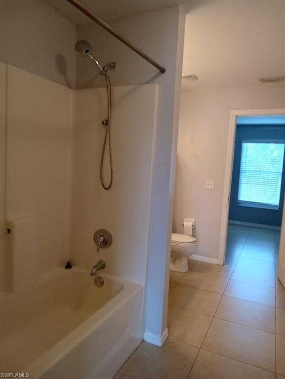 9148 Henry Road Fort Myers, FL 33967 - Photo 20 of 34 a bathroom with a tub a toilet and a shower