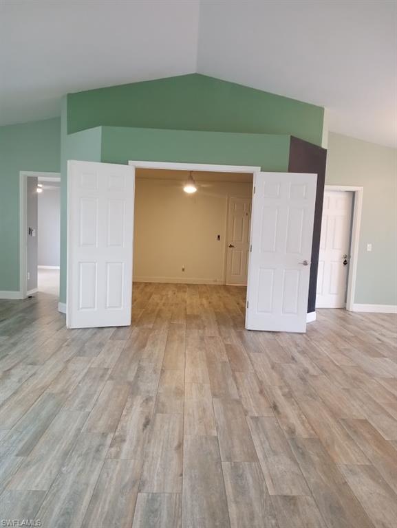 9148 Henry Road Fort Myers, FL 33967 - Photo 25 of 34 a view of a room with wooden floor