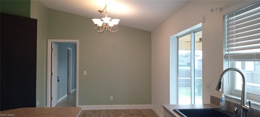 9148 Henry Road Fort Myers, FL 33967 - Photo 5 of 34 a view of a balcony with a chandelier