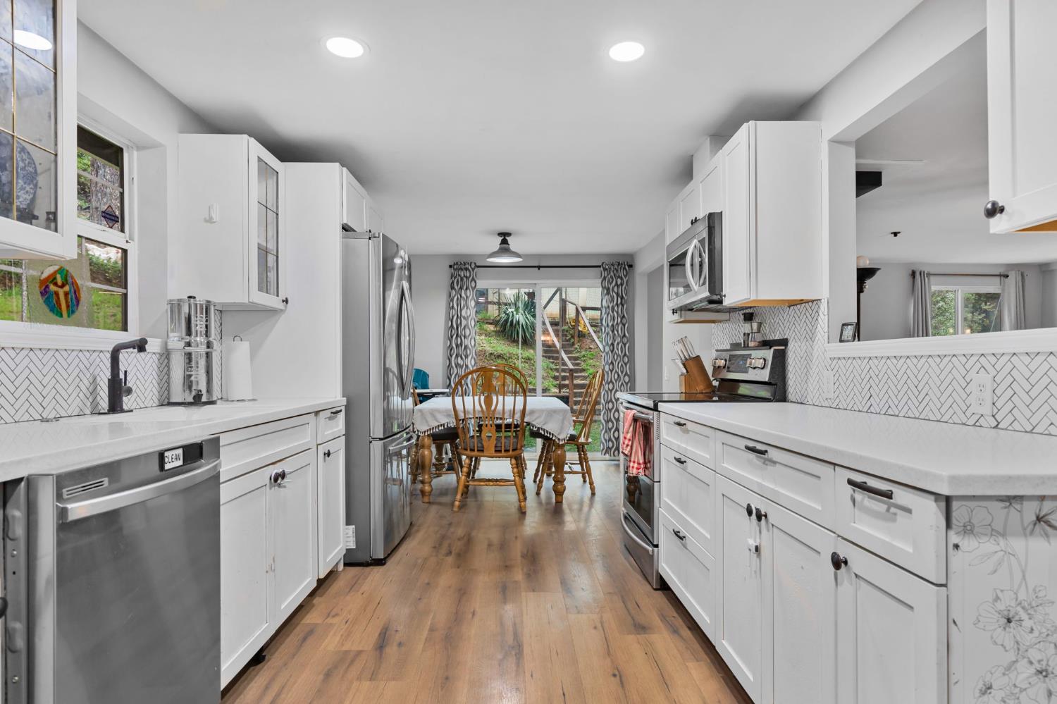 17721 Ridge Road Pine Grove, CA 95665 - Photo 3 of 21 a kitchen with stainless steel appliances sink stove top oven and cabinets