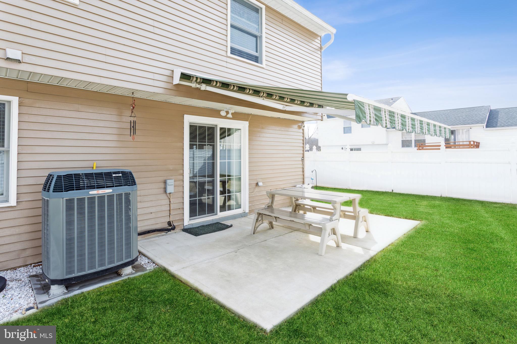 9318 Tulsemere Road Randallstown, MD 21133 - Photo 26 of 29 Rear Patio and retractable awning
