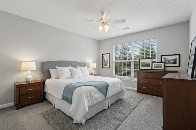 a bedroom with a bed and a television