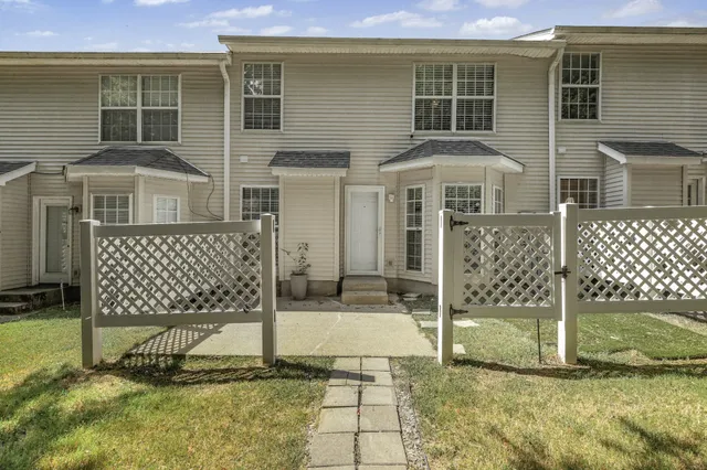 an aerial view of a house with outdoor space