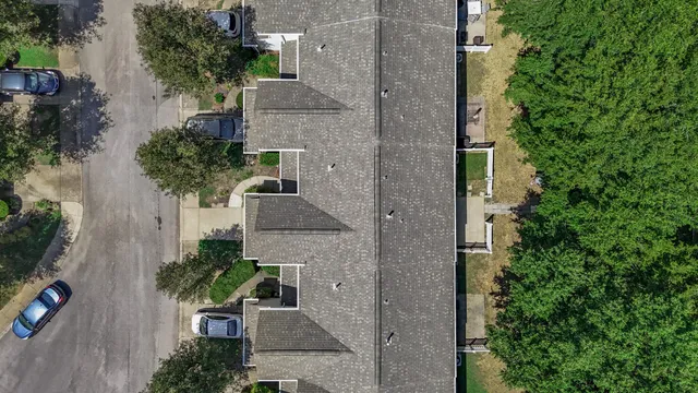 an aerial view of a house with a garden