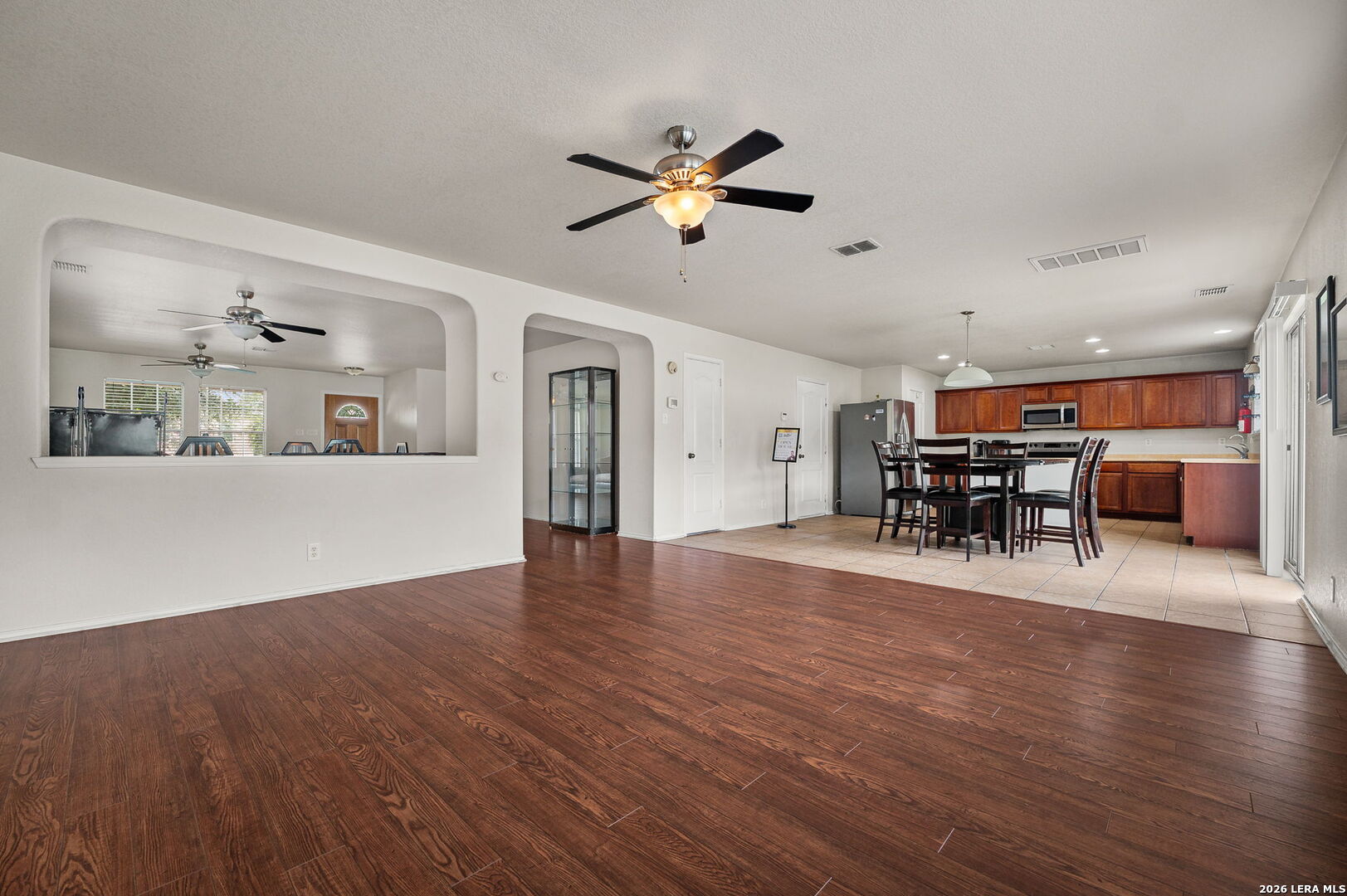 7207 Avery Road Live Oak, TX 78233 - Photo 13 of 32 a view of a work space with furniture and wooden floor