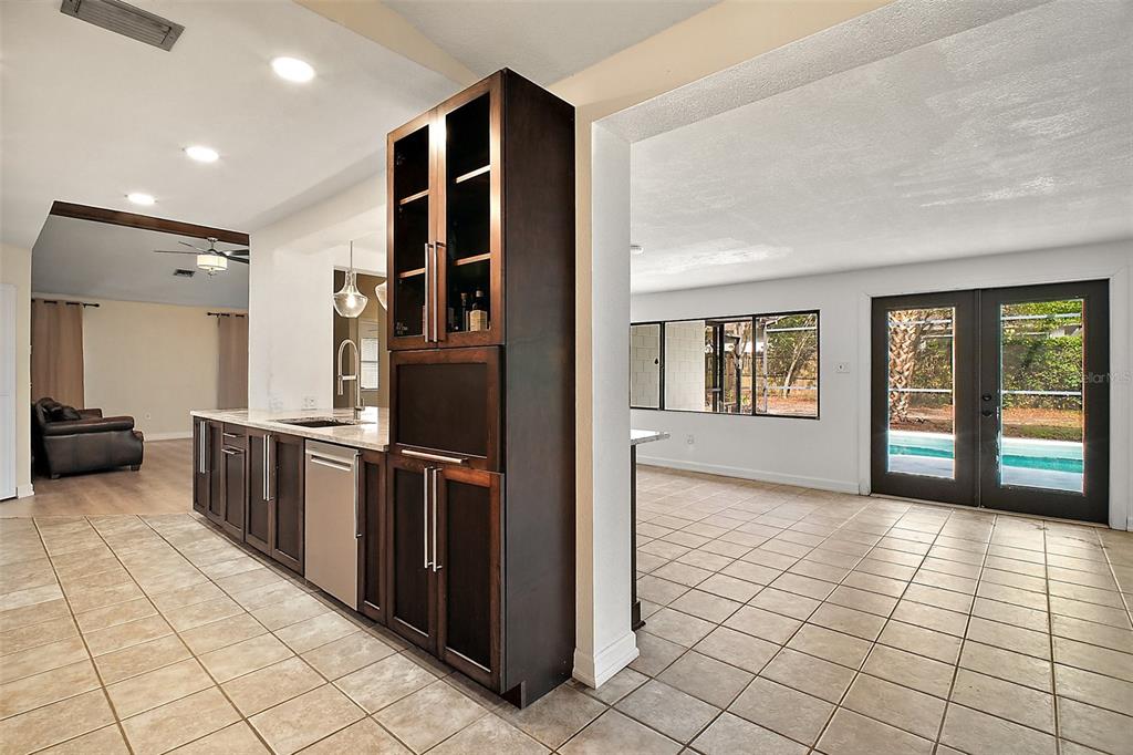 2309 Fairview Eustis, FL 32726 - Photo 14 of 27 a kitchen with stainless steel appliances granite countertop a refrigerator and a sink