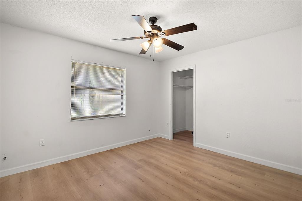 2309 Fairview Eustis, FL 32726 - Photo 18 of 27 an empty room with fan and windows