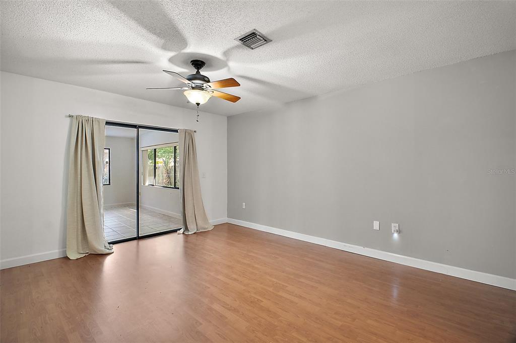 2309 Fairview Eustis, FL 32726 - Photo 24 of 27 an empty room with windows and fan