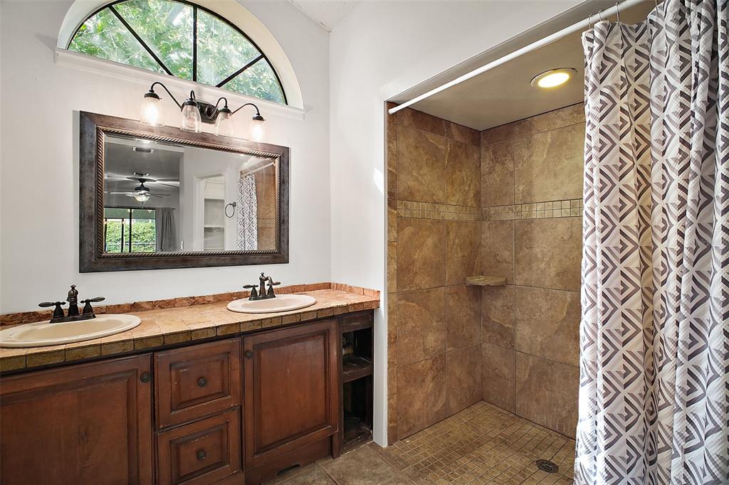 2309 Fairview Eustis, FL 32726 - Photo 27 of 27 a bathroom with a double vanity sink and a mirror