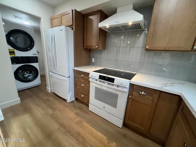 a kitchen with a stove and a refrigerator