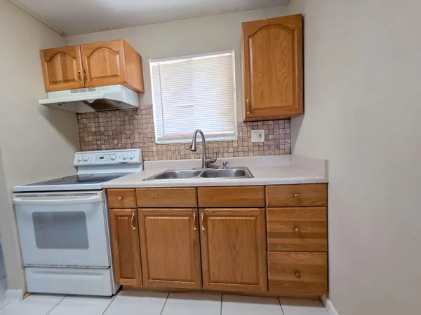a bathroom with a sink a vanity and a mirror