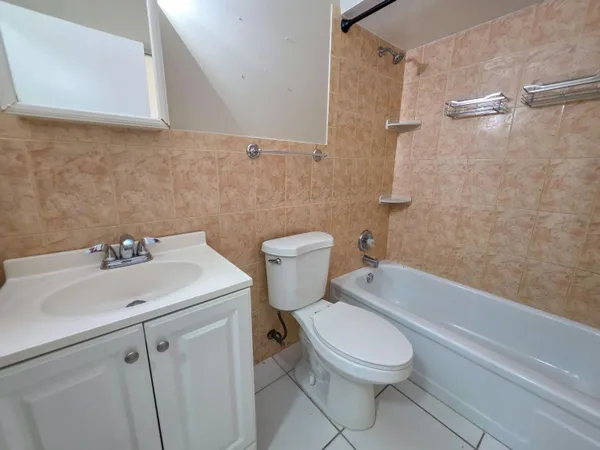 a bathroom with a sink a toilet and a bathtub