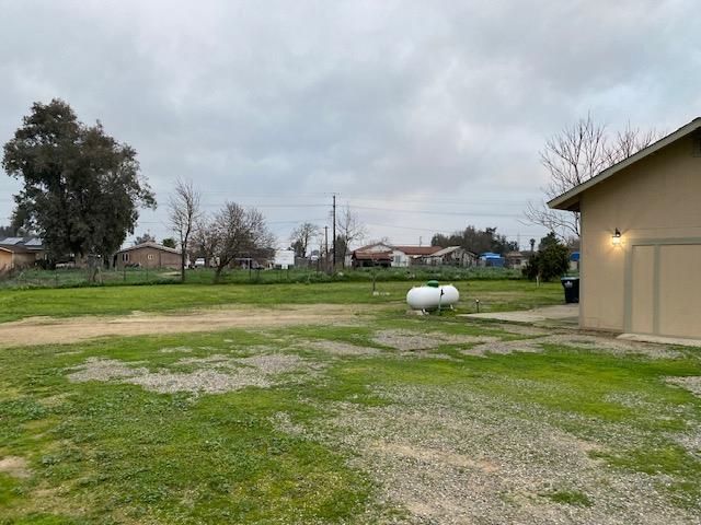 15792 Raymond Road Madera, CA 93638 - Photo 17 of 18 a backyard of a house with lots of green space