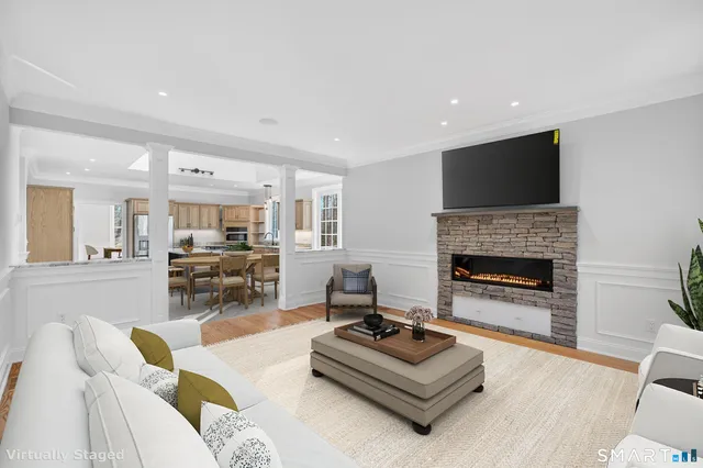 a view of staircase with white walls and white door