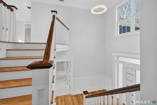 a view of entryway with wooden floor