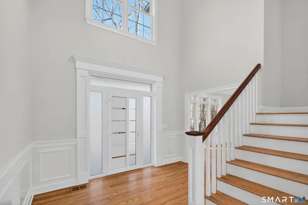 a view of a room with wooden floor