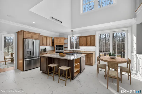 a kitchen that has a stove and a table in it