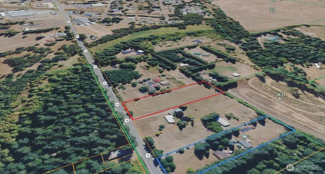 an aerial view of a house with a yard