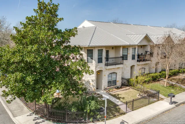 an aerial view of a house with swimming pool