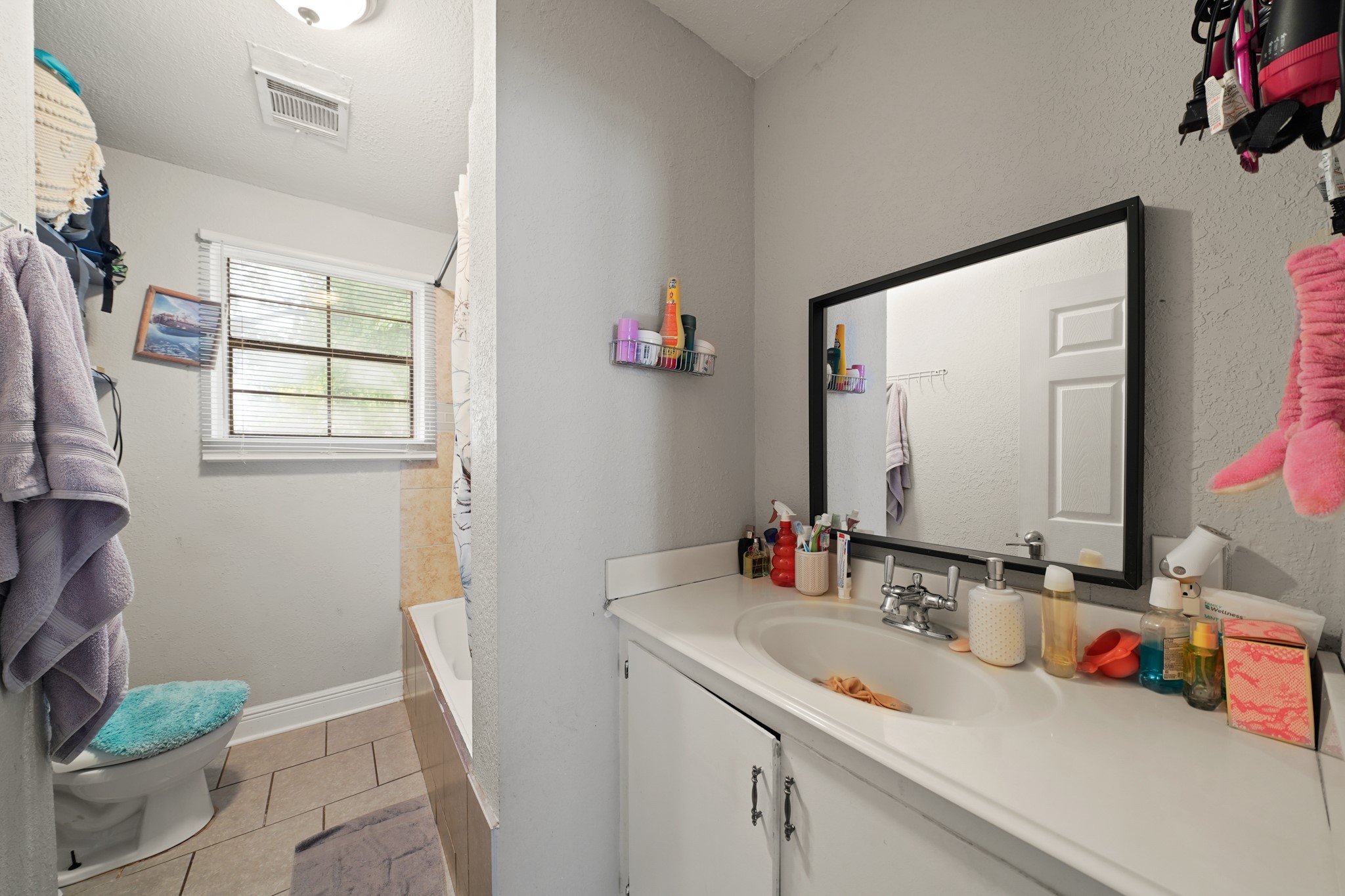 5307 Crane Street Houston, TX 77026 - Photo 11 of 41 a bathroom with a sink toilet and a mirror